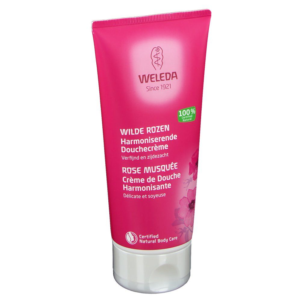 Tube rose avec nom du produit et logo. Logo "Weleda" et texte. "Wilde Rosen" et "Rose Musquée" imprimés. Produit naturel certifié.