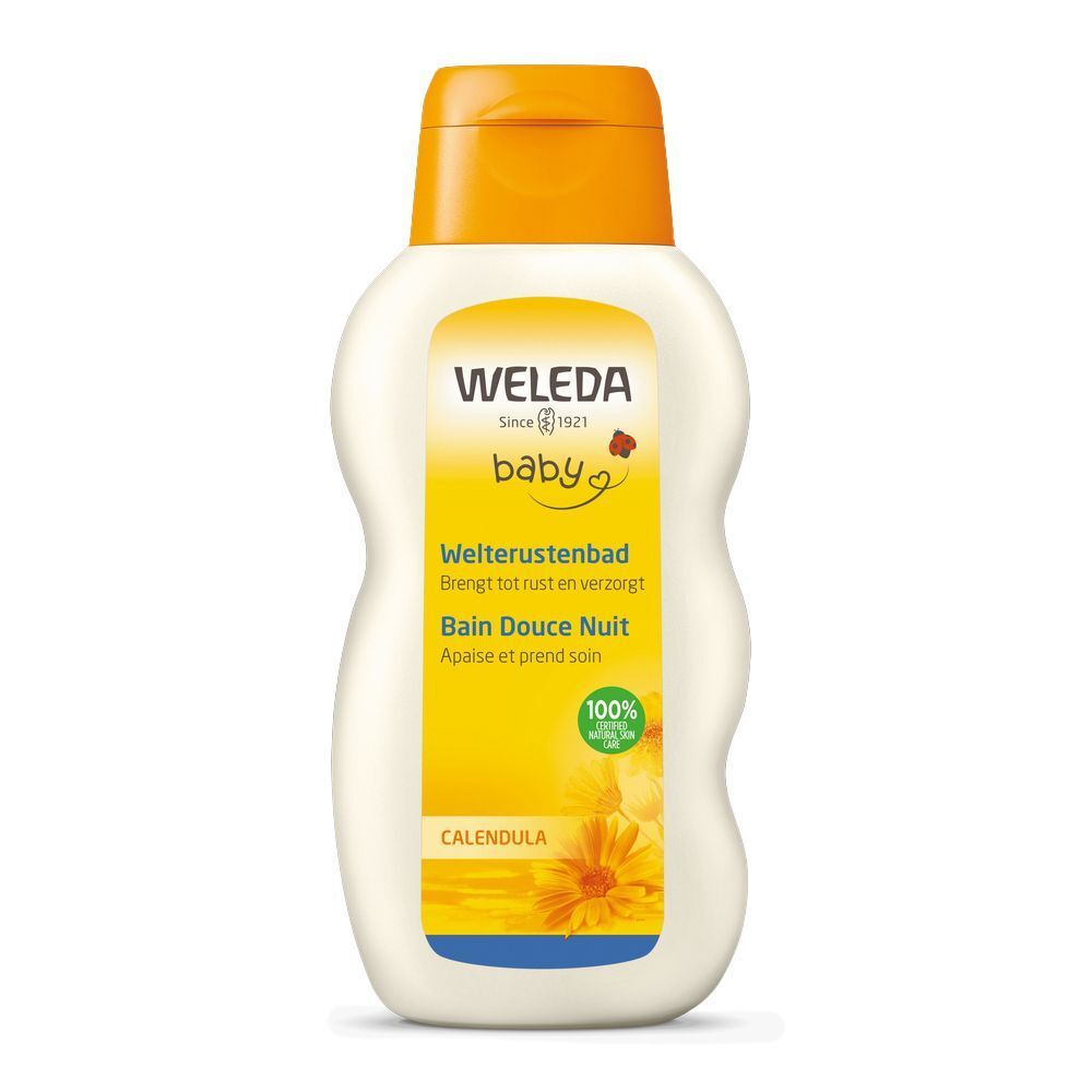 Flacon Weleda Baby Bain Douce Nuit. Étiquette jaune avec nom du produit, ingrédients et certifications. Bouchon orange.