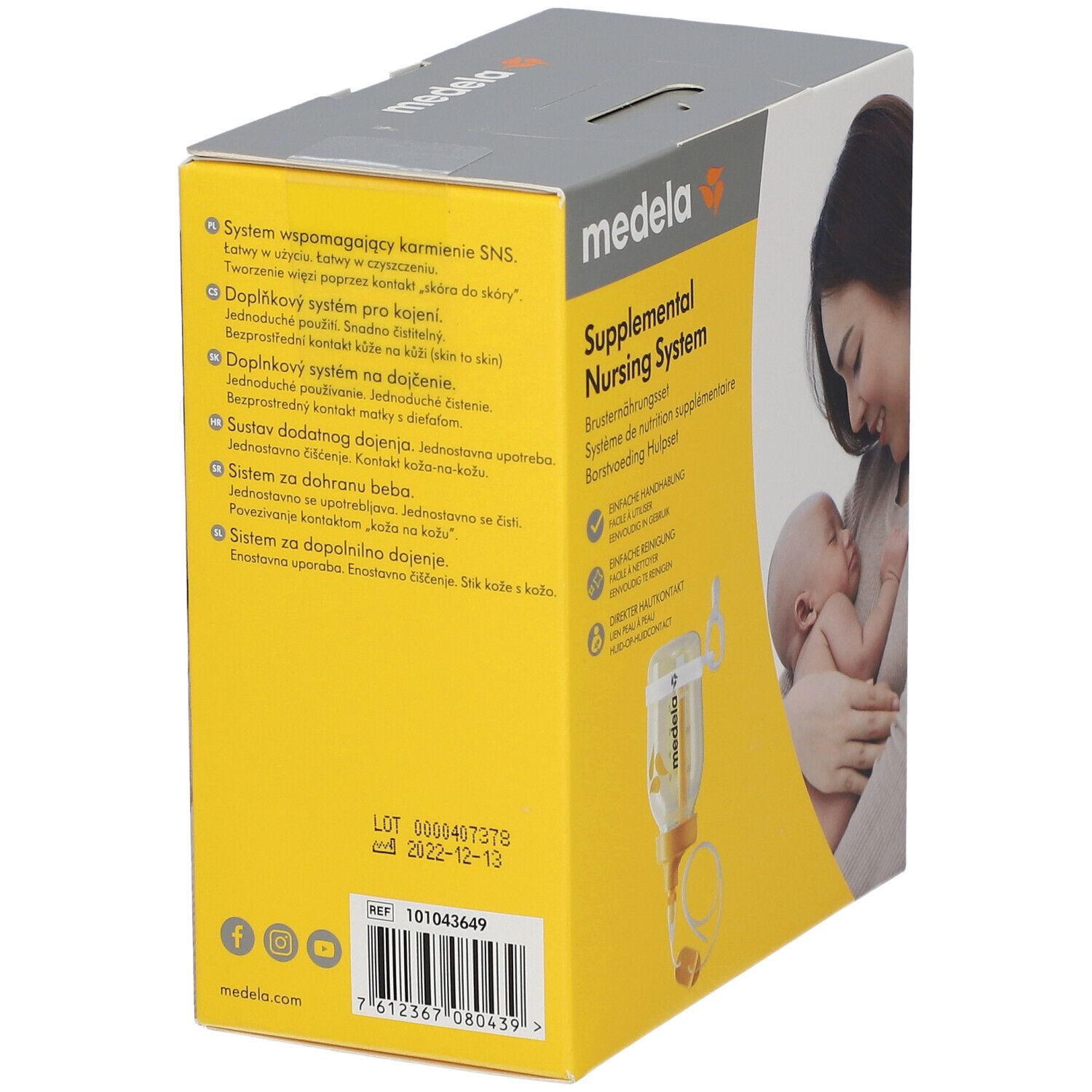 Rückseite der Medela Brusternährungsset-Verpackung. Text in mehreren Sprachen. Gelber Hintergrund. Produktabbildung. Haltbarkeitsdatum.