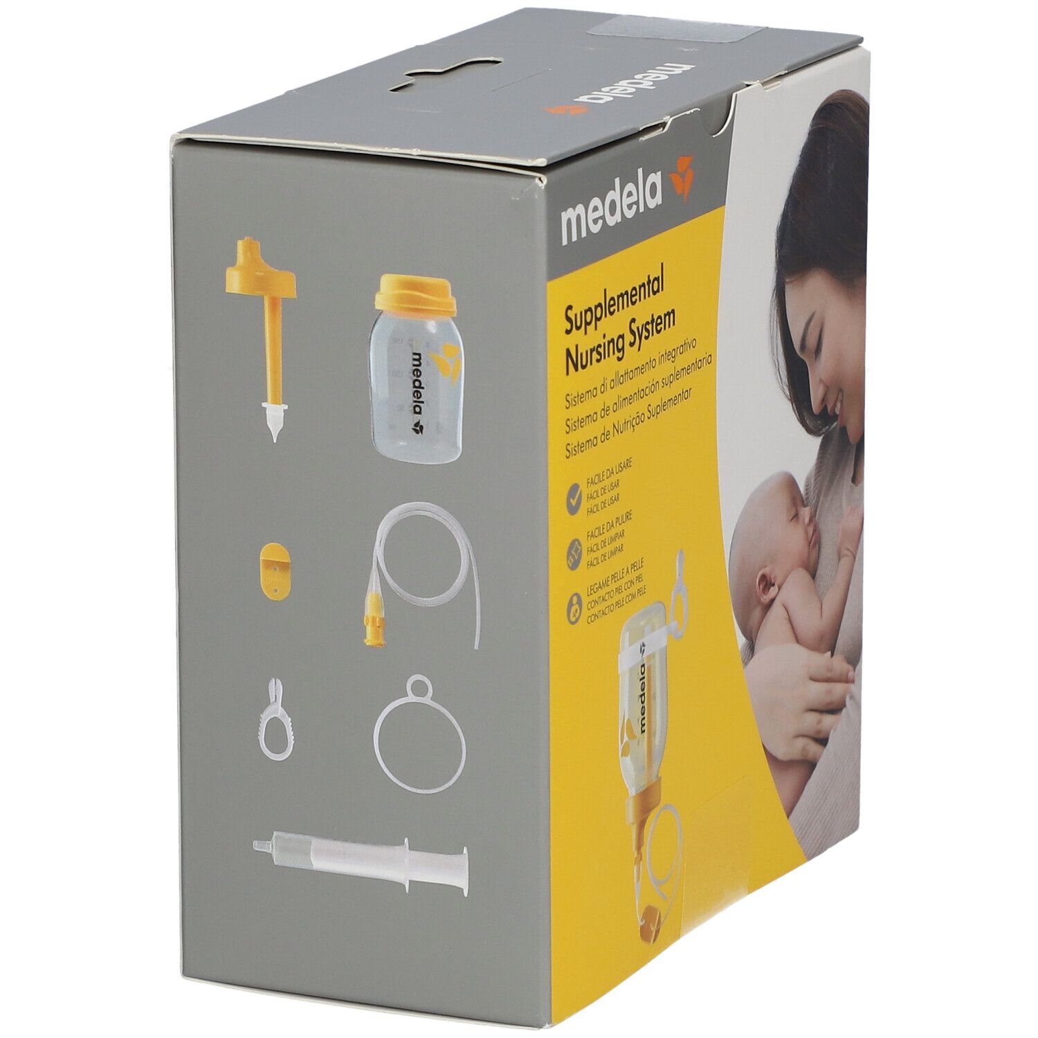 Medela Brusternährungsset-Verpackung. Gezeigt: Flasche, Schläuche, Zubehör. Grauer Hintergrund. Produktabbildung. Gelb-weiße Box.