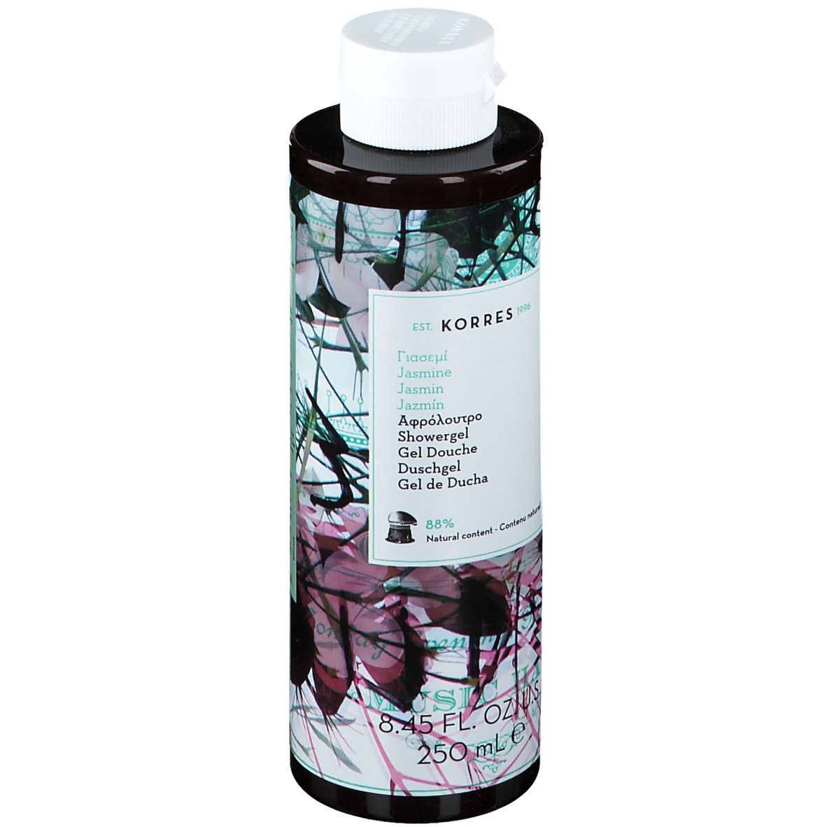 Gel douche KORRES Jasmine. Flacon cylindrique, bouchon blanc. Étiquette avec nom du produit et motif floral. 250 ml.