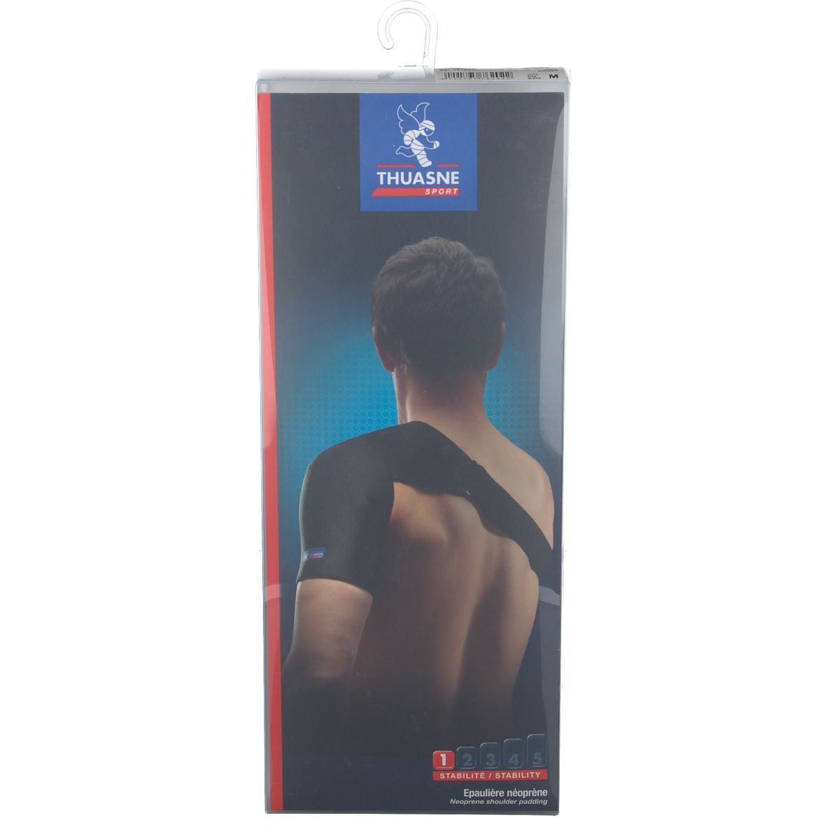 Bandage d'épaule dans un emballage. Marque Thuasne Sport. Bandage noir sur le corps d'une personne. Inscription : Stabilité.