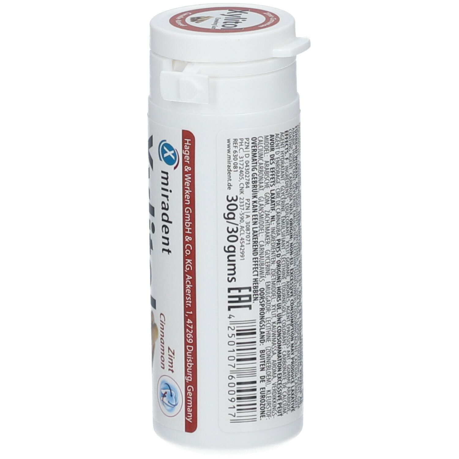 Contenant blanc avec étiquette rouge. Inscription: miradent, Cannelle. Texte et code-barres. Indication: 30g/30 goms. Adresse du fabricant.