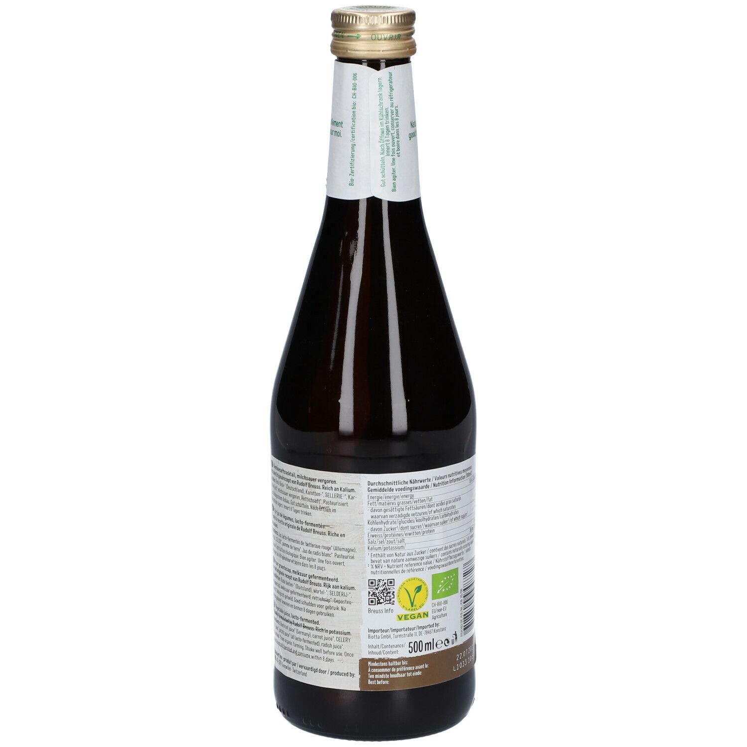 Dos d'une bouteille en verre brun. Étiquette avec texte, label vegan et label bio. Bouchon doré.