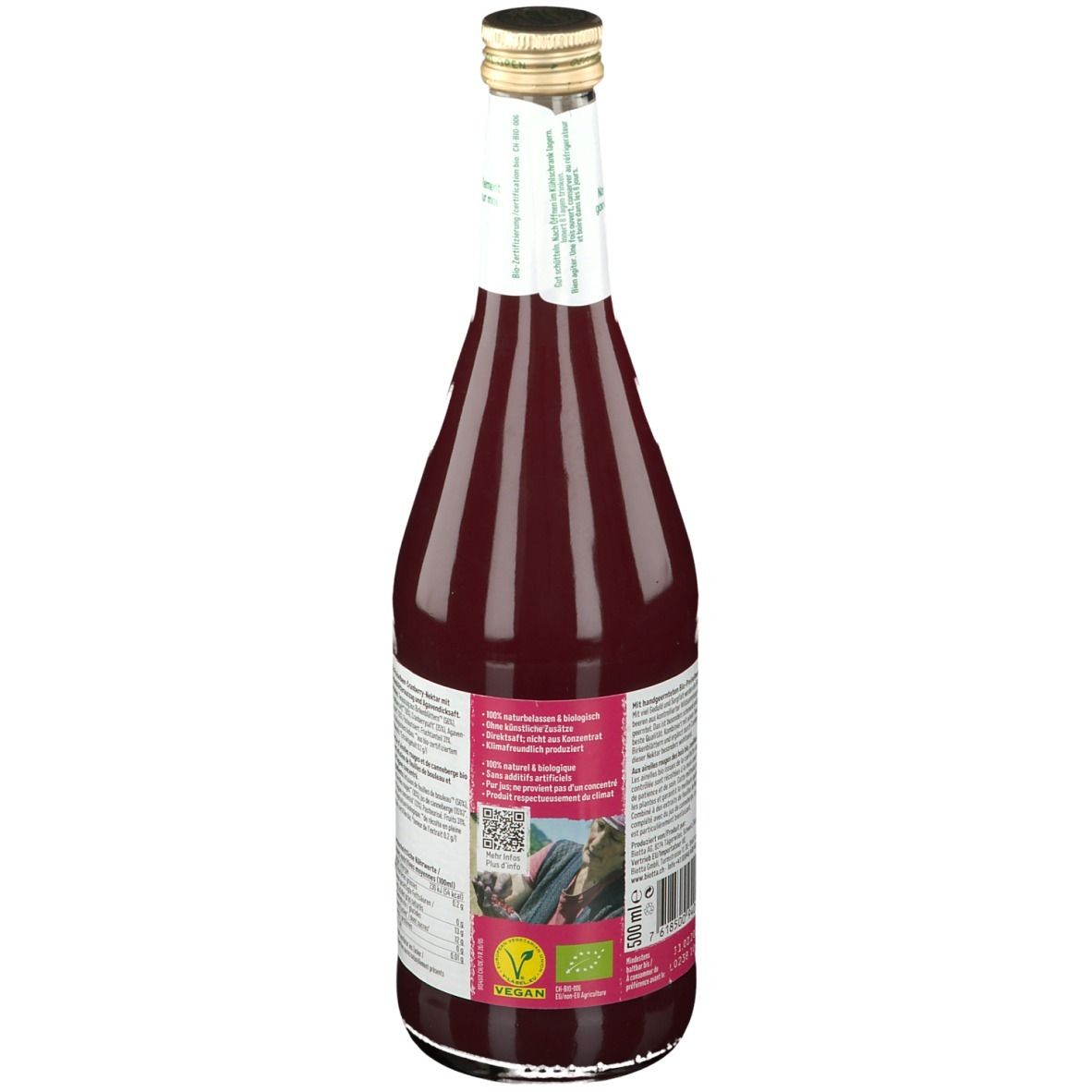 Dos d'une bouteille en verre de jus rouge. Étiquette avec texte, label bio et logo vegan. Bouchon doré.
