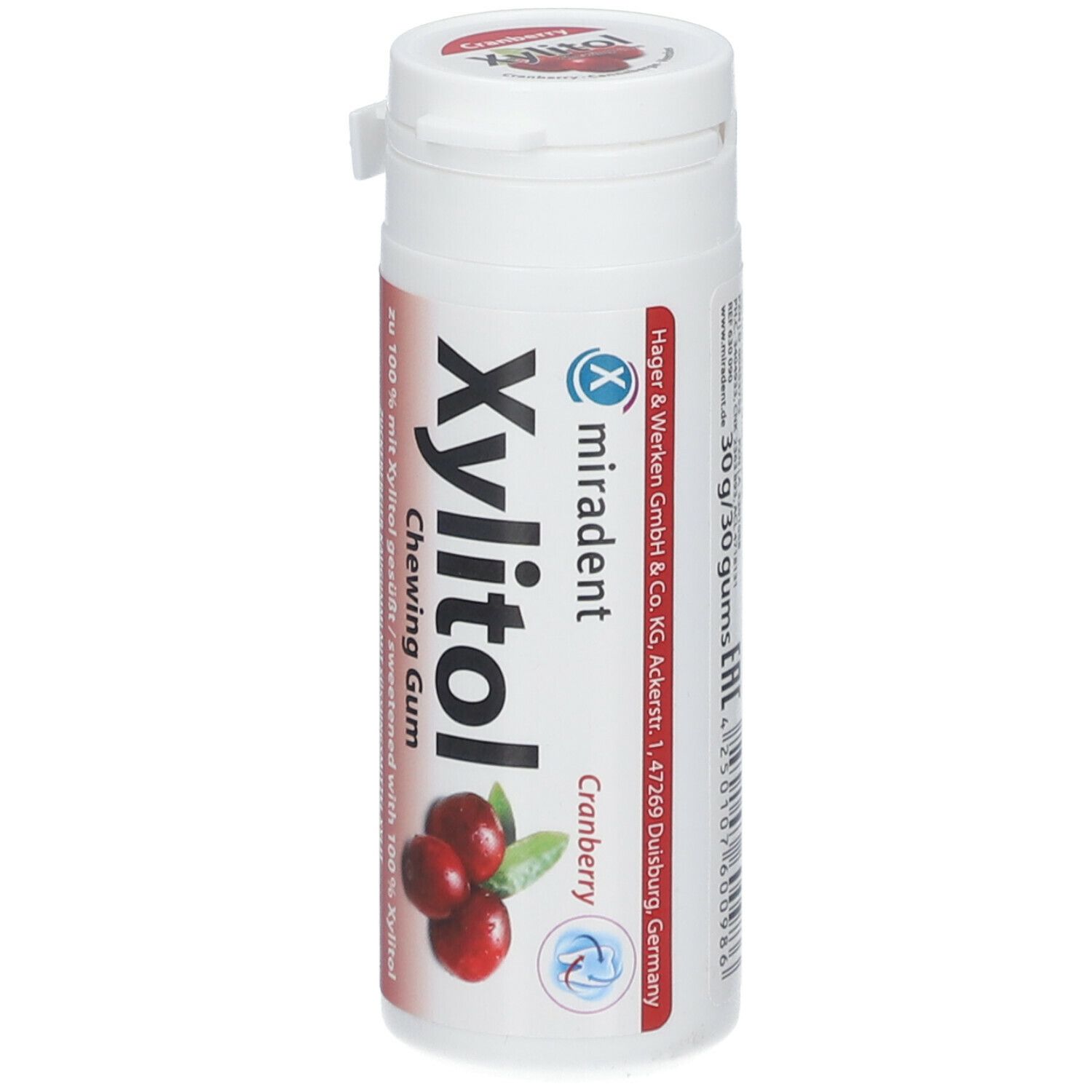 Witte cilindrische doos met Miradent Xylitol kauwgom. Cranberry-illustratie. Tekst: Suikervrije kauwgom met zoetstof xylitol. 30g/30 gums.