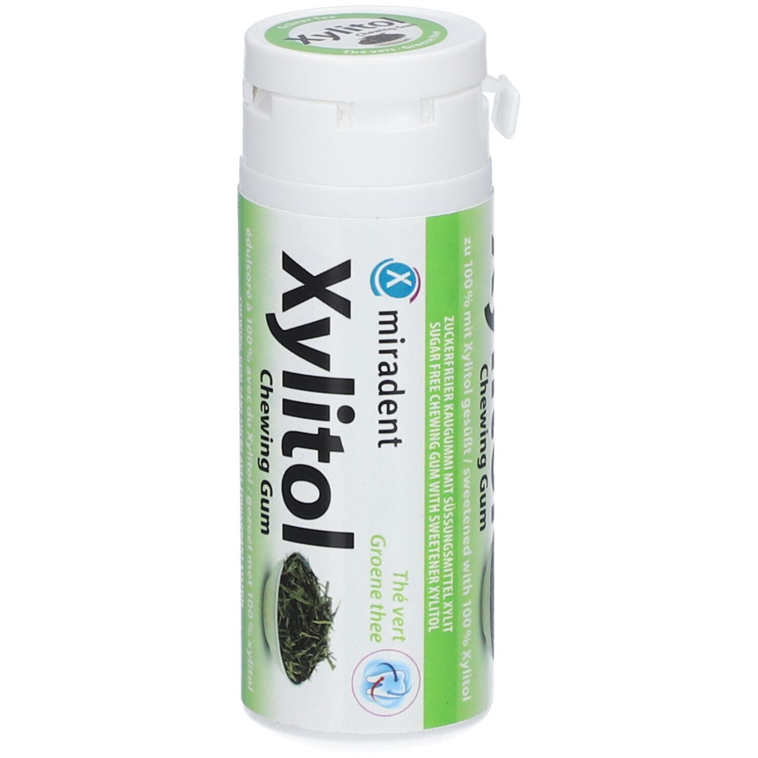Flacon blanc avec étiquette verte. Inscription : Xylitol Chewing Gum, Thé Vert. Logo Miradent.