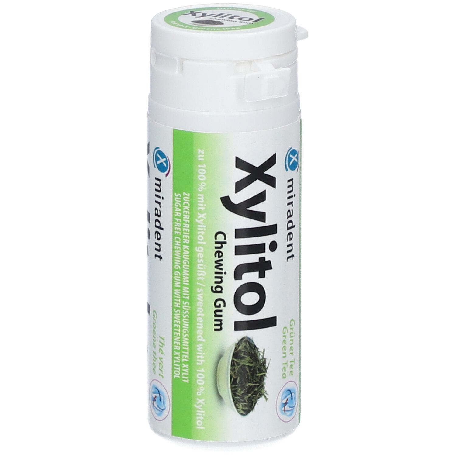 Flacon blanc avec étiquette verte. Inscription : Xylitol Chewing Gum, Thé Vert. Logo Miradent.