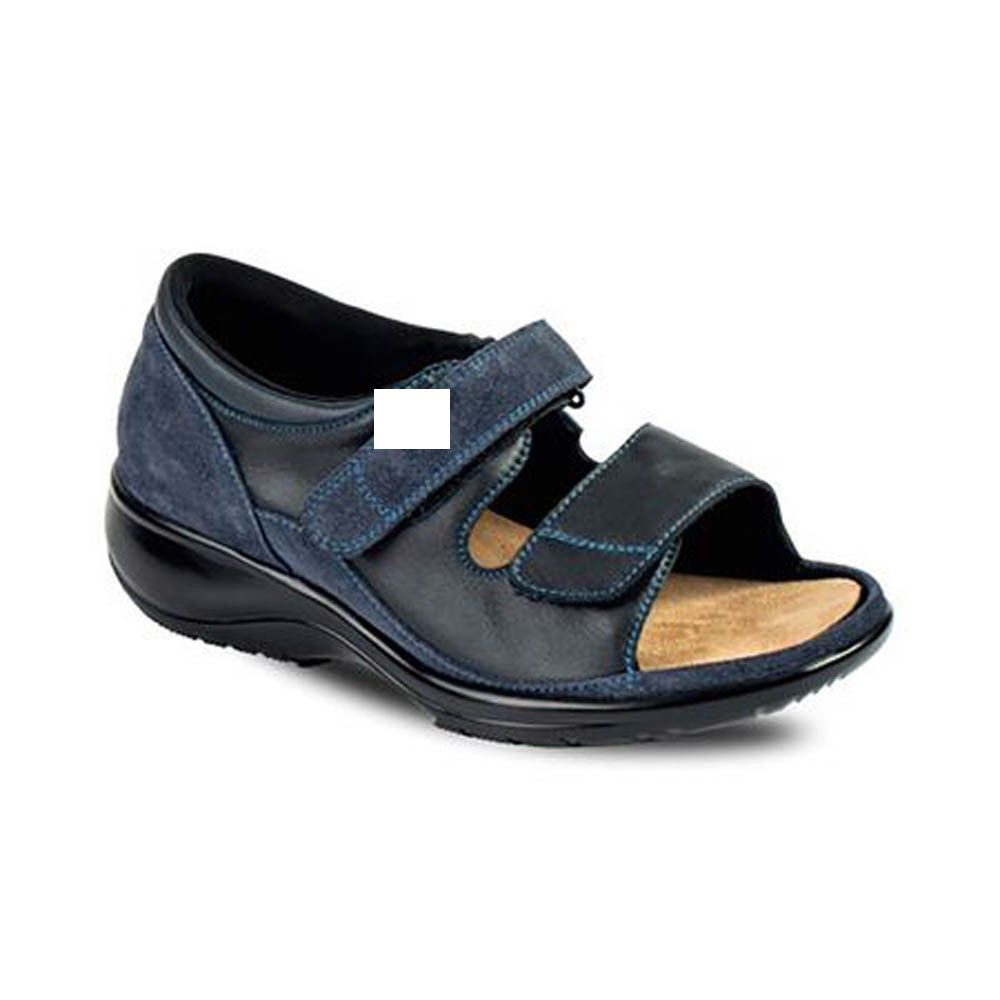 Sandale bleue pour femme. Dessus en cuir et daim. Fermetures velcro. Semelle noire. Semelle intérieure beige.