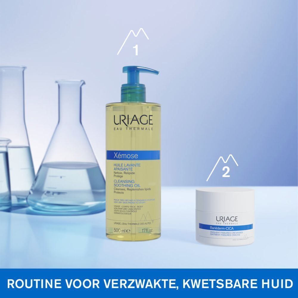 Witte pot met deksel. Blauwe band met Uriage Bariéderm. Productnaam en tekst.