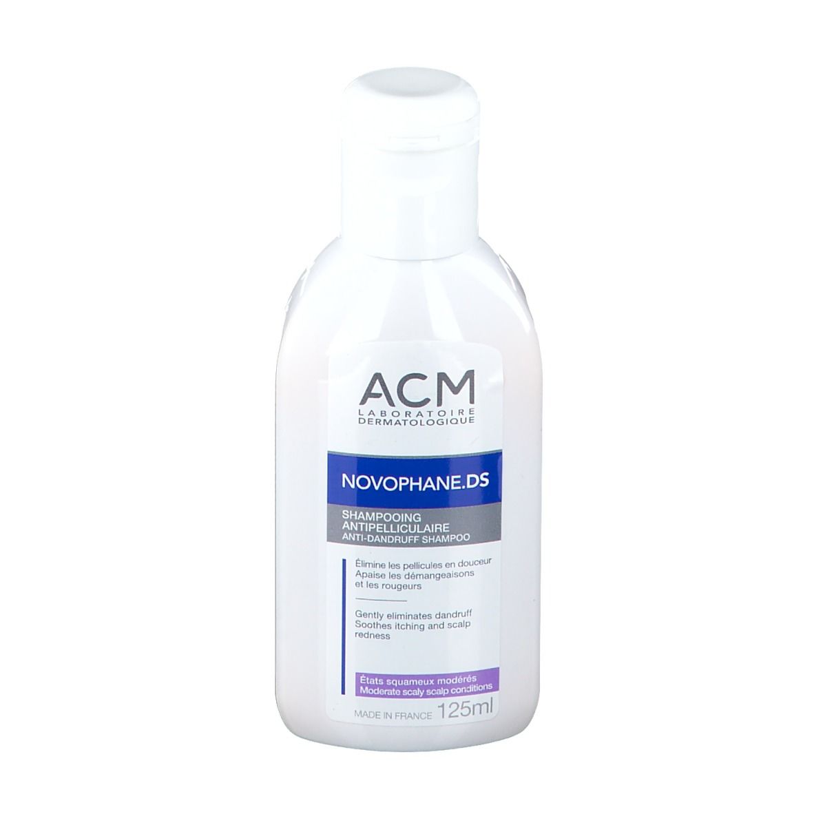 Flacone bianco di shampoo Novophane.DS ACM. Etichette blu e viola. Tappo bianco.