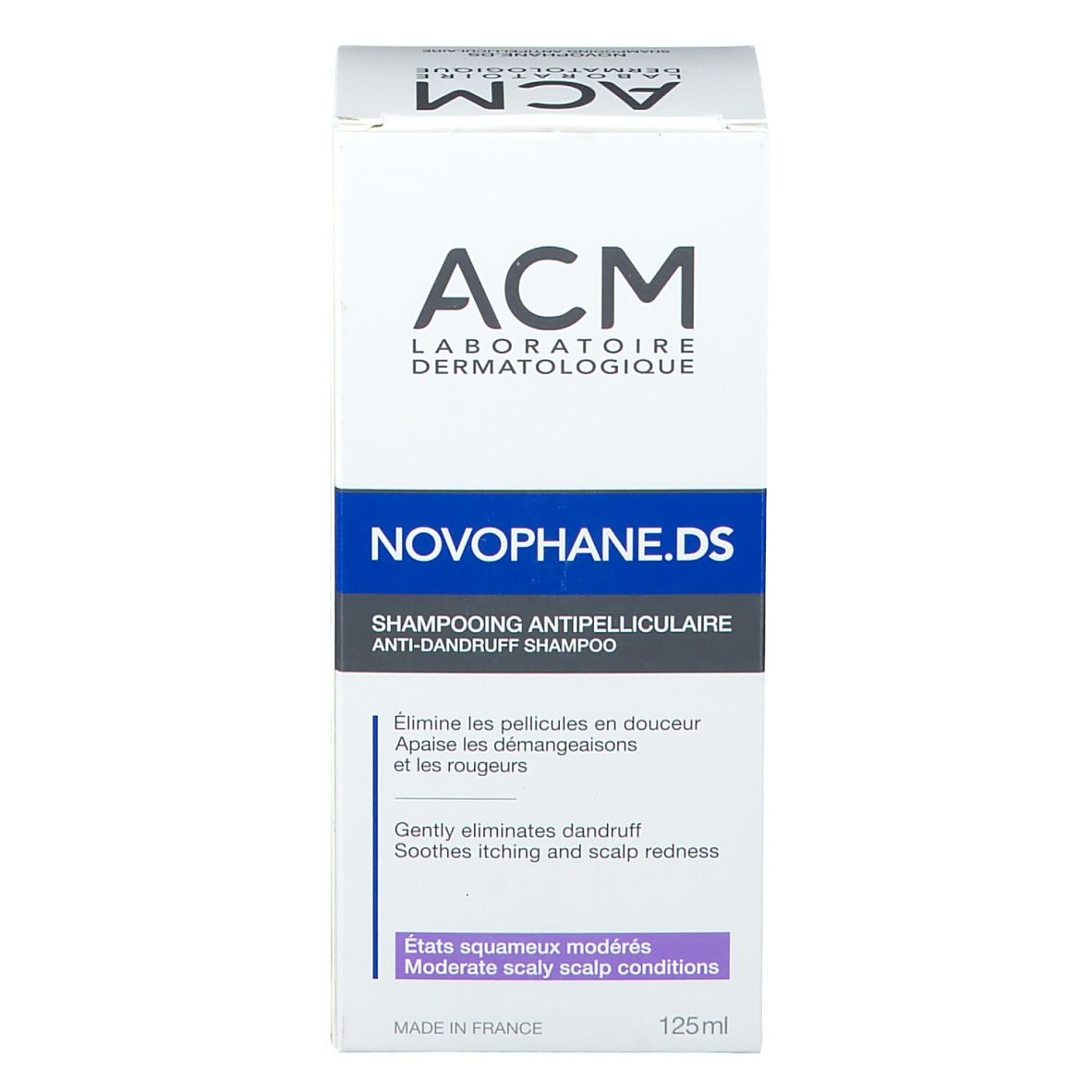 Scatola bianca di shampoo Novophane.DS ACM. Etichette blu e viola. Testo descrittivo.
