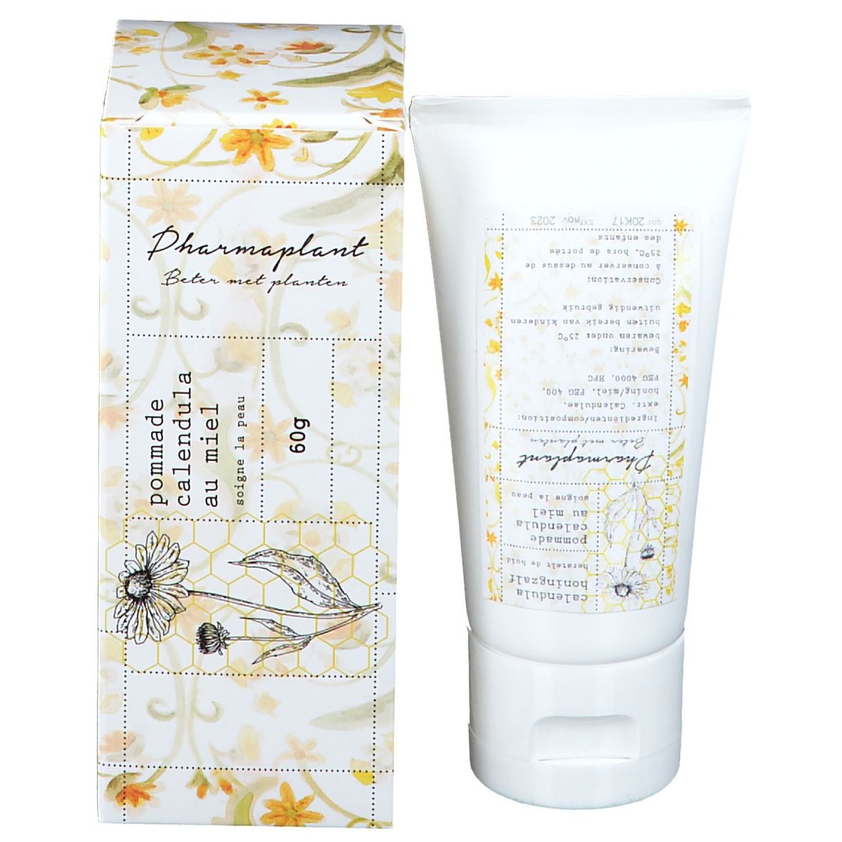 Verpakking en tube. Verpakking met bloemmotief en opschrift: Pharmaplant, Calendula Honig Salbe.