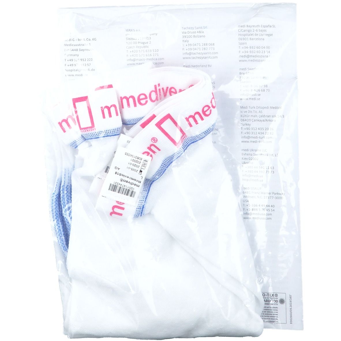 Inhoud van de verpakking mediven thrombexin 18. Witte compressiekousen en accessoires, deels zichtbaar.