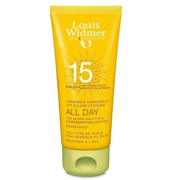 Tube jaune de lait solaire. Inscriptions: Louis Widmer, 15, All Day. Résistant à l'eau. Protection moyenne.
