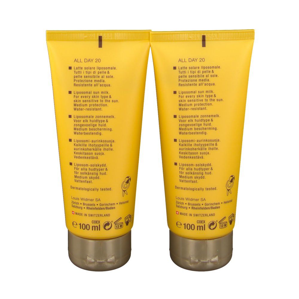 Deux tubes jaunes de crème solaire. Dos avec texte multilingue. Inscription: Louis Widmer, 100 ml.