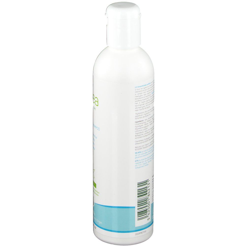 Flacon blanc de shampooing Aurea Aloe Vera, vue latérale. Étiquette avec ingrédients et code-barres.