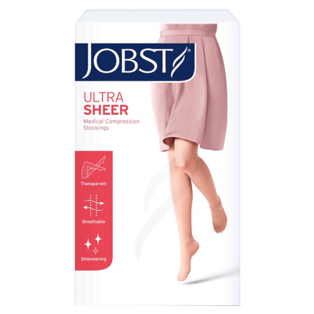 Bas de contention Jobst Ultrasheer Kl1. Emballage avec image du produit et caractéristiques : transparent, respirant, scintillant.