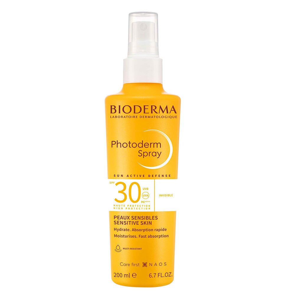 Flacon spray jaune avec tête blanche. Inscription: BIODERMA Photoderm Spray SPF 30. Pour peaux sensibles.