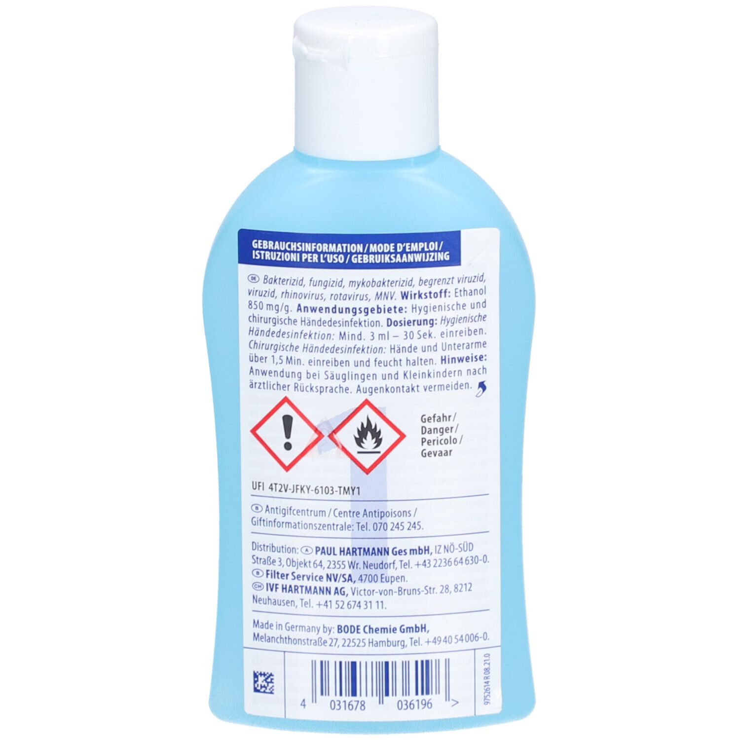 Dos d'un flacon bleu clair. Texte: Informations d'utilisation, avertissements, symboles de danger.