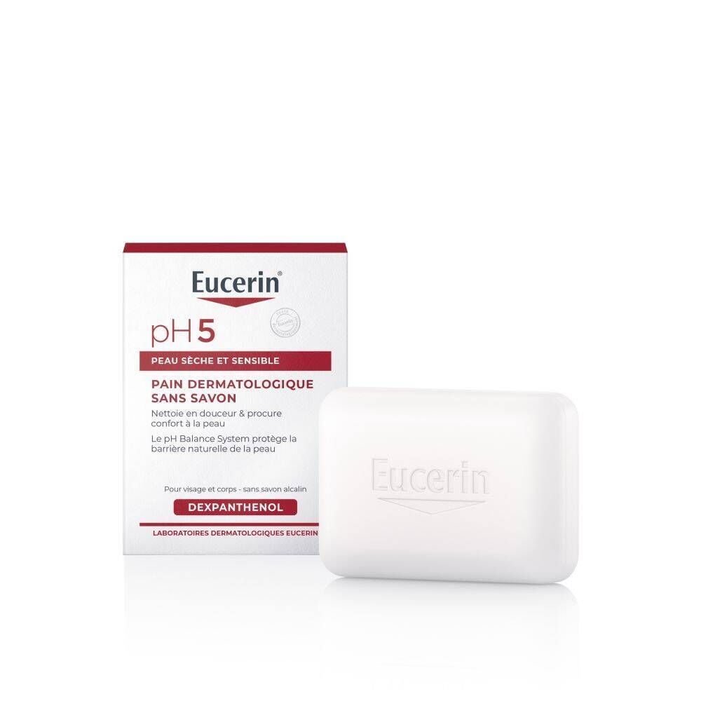 Pain dermatologique sans savon Eucerin pH5 et emballage. Pain de savon blanc et boîte avec texte rouge.