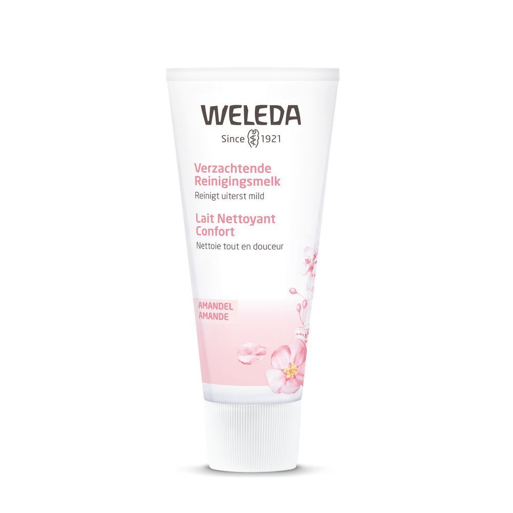 Tube Weleda, rose et blanc, avec nom du produit et illustration florale. Texte : 'Verzachtende Reinigingsmelk', 'Lait Nettoyant Confort'.