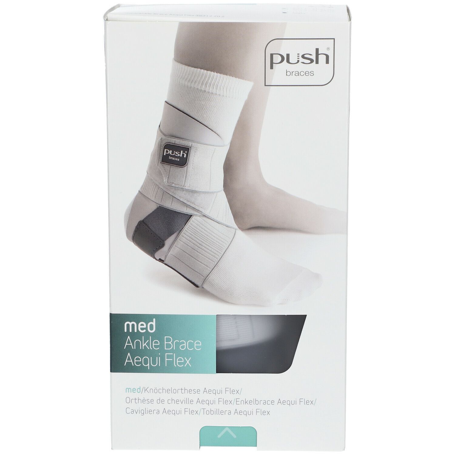 Orthèse de cheville dans son emballage. Marque Push. Bandages gris et blancs. Nom du produit : med Ankle Brace Aequi Flex.