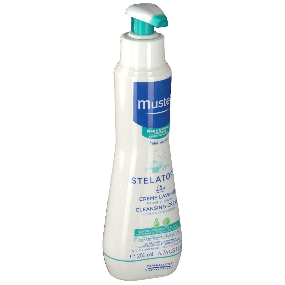 Flacon blanc avec pompe. Inscription: Mustela, Stelatopia Crème Lavante, Cleansing Cream. Contient de l'extrait d'avocat. 200 ml.