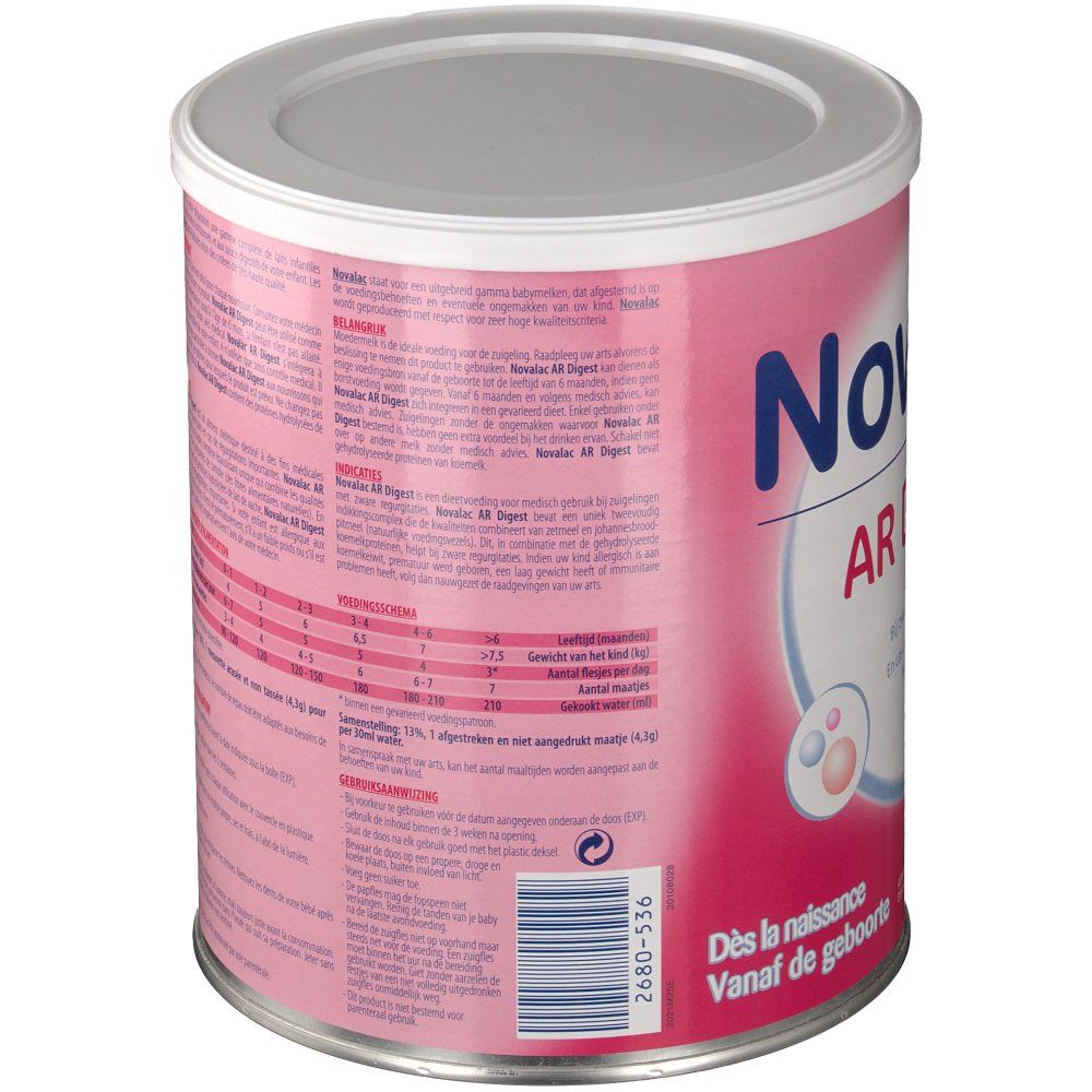 Boîte rose avec texte et couvercle argenté. Texte multilingue. Code-barres et informations produit.