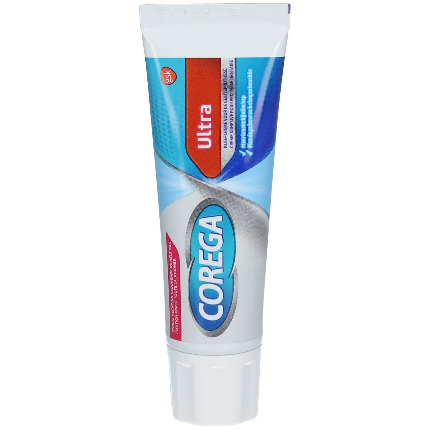 Zahncreme-Tube mit rotem und blauem Design. Aufschrift "Ultra" und "Corega". Weiße Kappe.