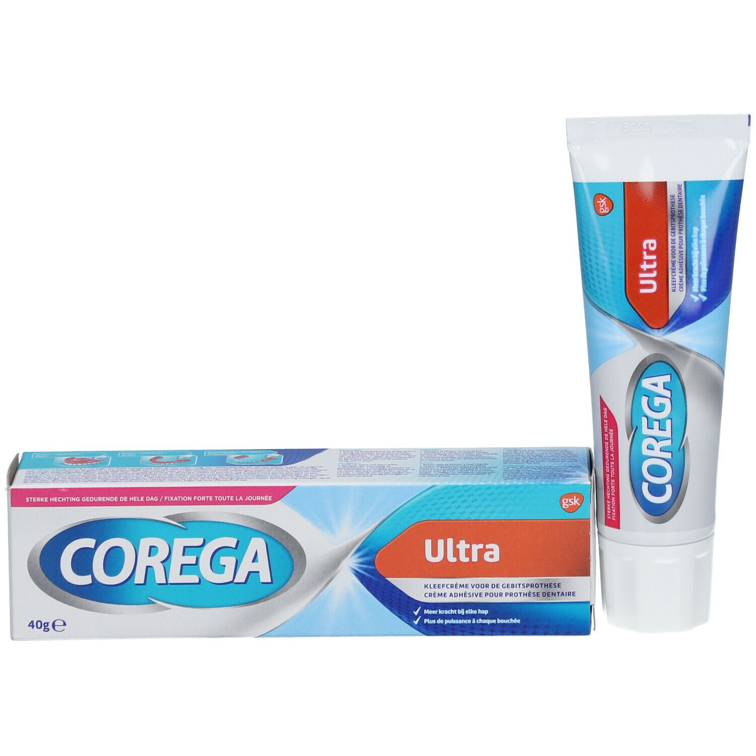 Tube und Schachtel. Tube mit rotem und blauem Design. Schachtel mit "Corega" und "Ultra".
