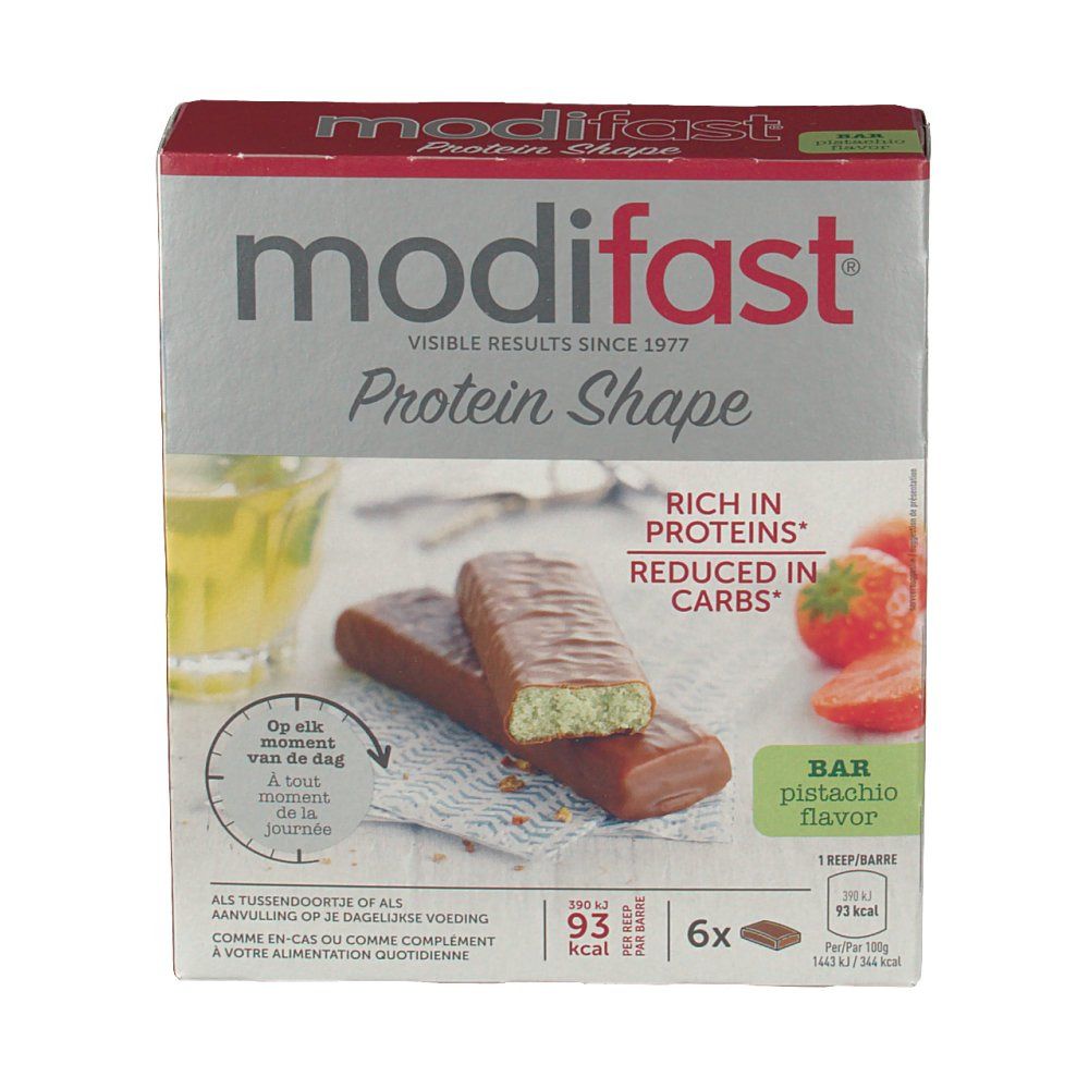 Verpackung von Modifast Proti Plus Barre Pistache. Enthält 6 Riegel. Aufdrucke: Protein Shape, Pistaziengeschmack, reich an Proteinen, reduziert an Kohlenhydraten.