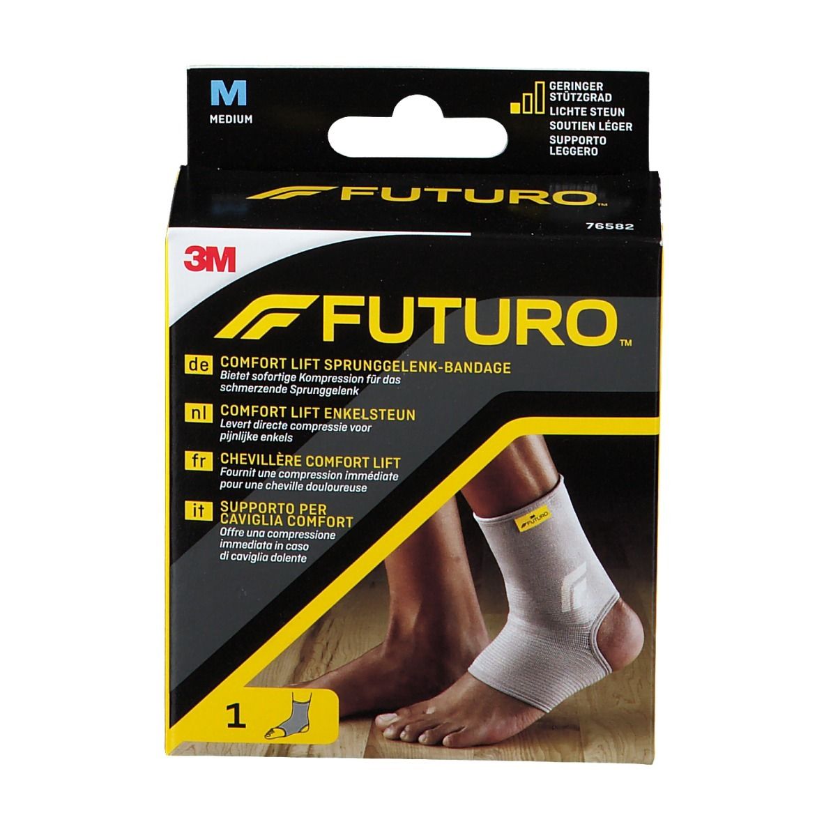 3M FUTURO Comfort Lift Knöchelbandage, Größe M, in Verpackung. Produktabbildung mit Bandage am Fuß. Schwarz-gelbe Verpackung.