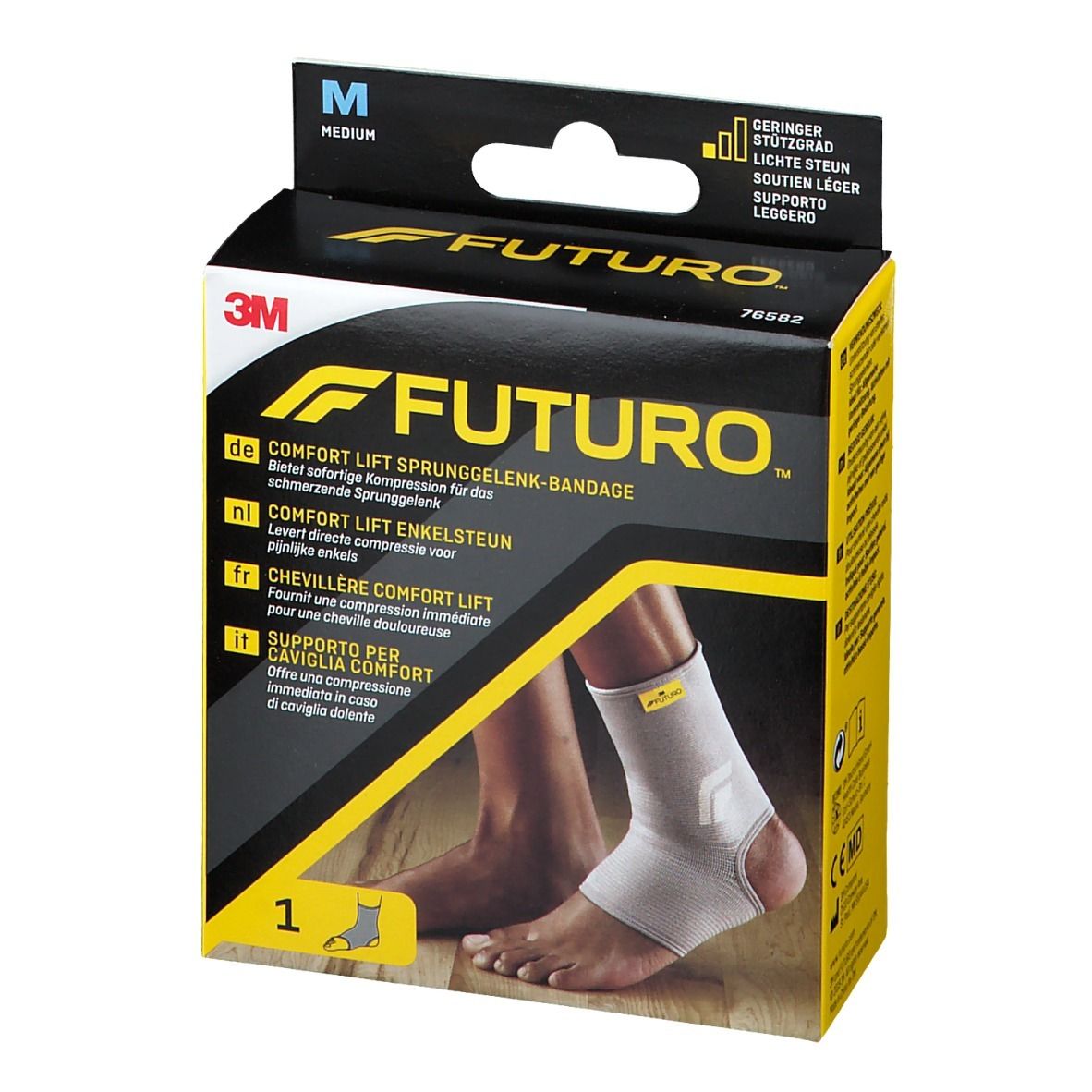 3M FUTURO Comfort Lift Knöchelbandage, Größe M, in Verpackung. Produktabbildung mit Bandage am Fuß. Schwarz-gelbe Verpackung.