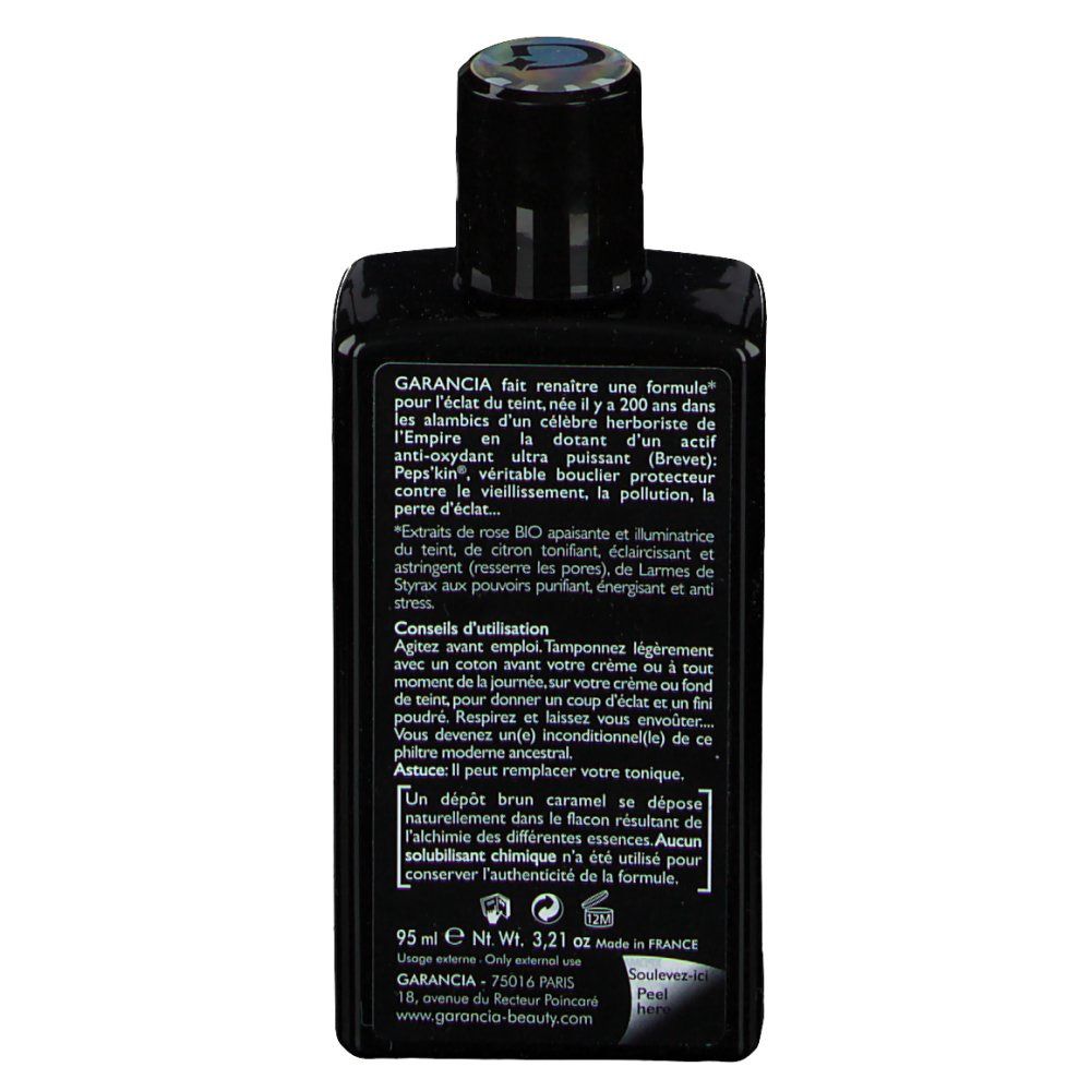 Dos du flacon noir. Texte en français. Contient des informations sur le produit et la marque Garancia.