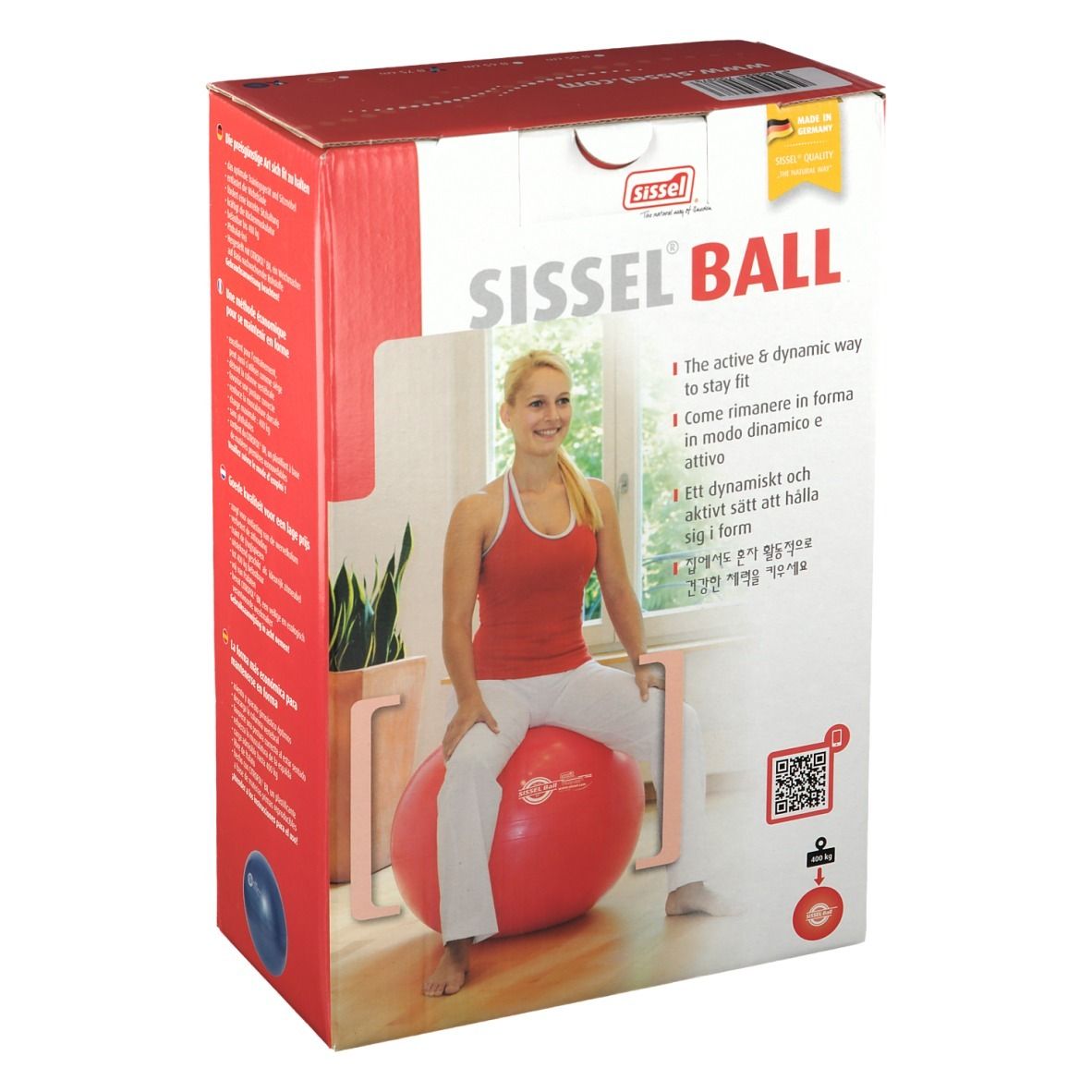 Boîte Sissel Ball rouge. Femme assise sur le ballon. Inscription: Sissel Ball.
