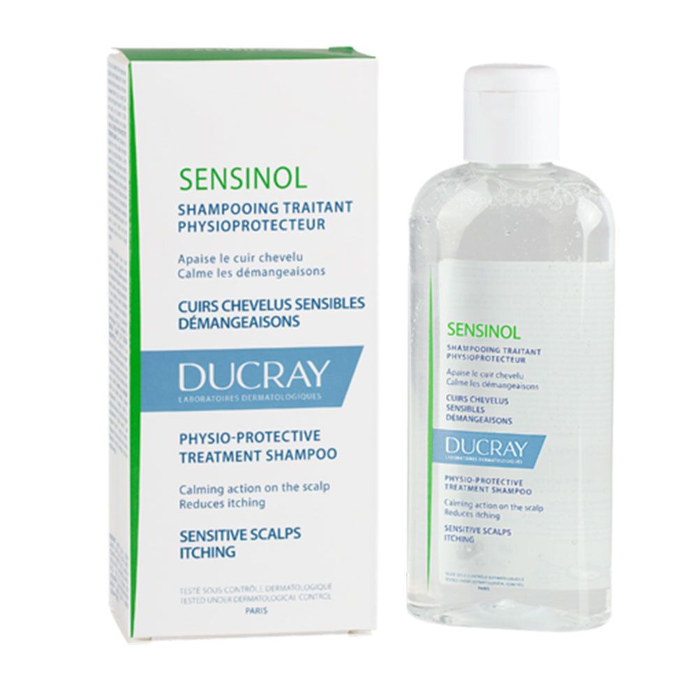 Shampoo fles en doos. Tekst: SENSINOL, DUCRAY. Voor gevoelige hoofdhuid. Groene en witte verpakking.