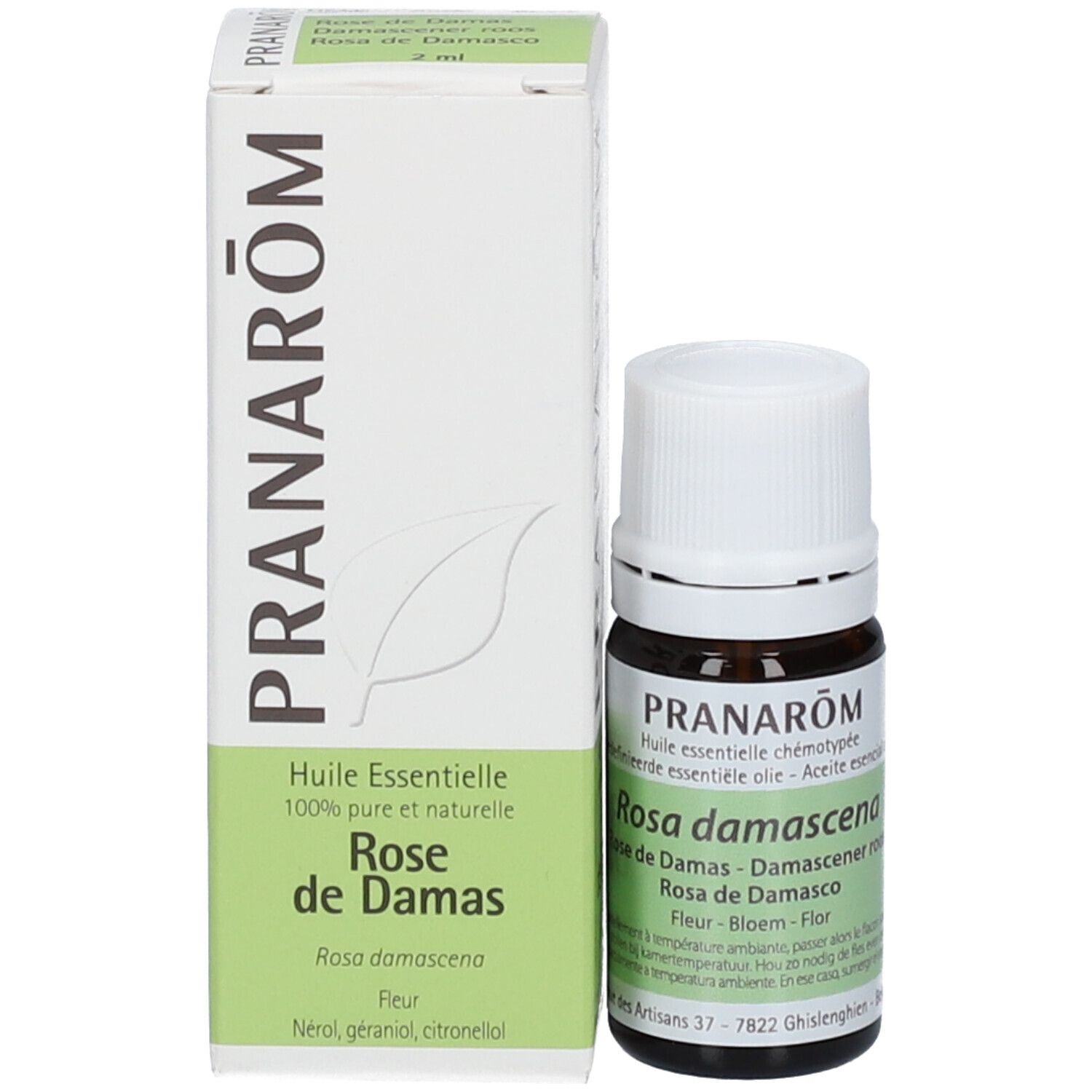 Flacon en verre brun avec bouchon blanc et carton. Carton avec texte: PRANAROM, Rose de Damas, huile.