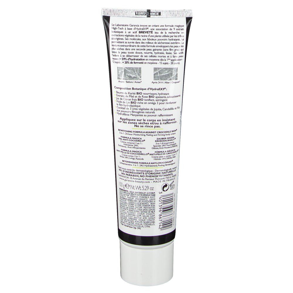Dos du tube. Informations produit, ingrédients, coordonnées fabricant. Fond noir, écriture blanche.