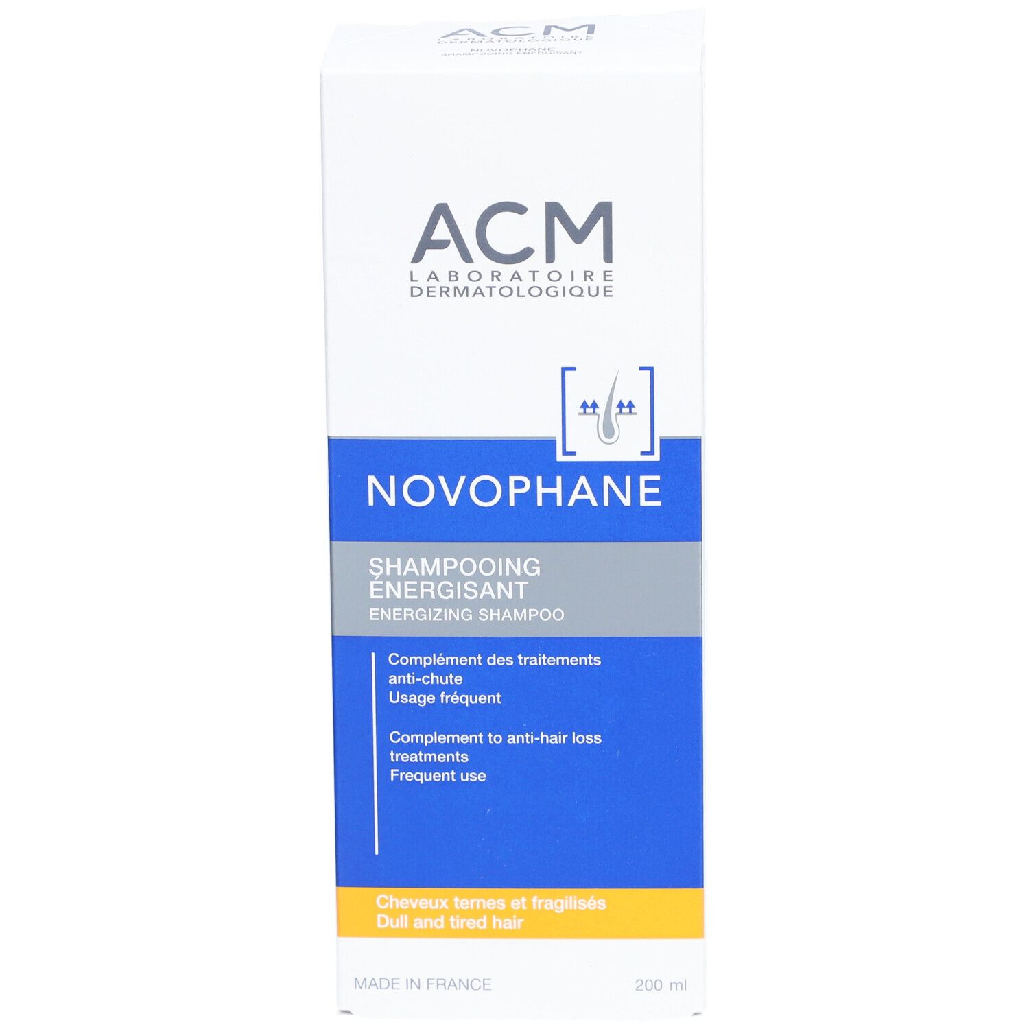 Boîte blanche avec texte bleu et gris. Inscription: ACM, Novophane, Shampooing Énergisant. Pour cheveux ternes et secs.