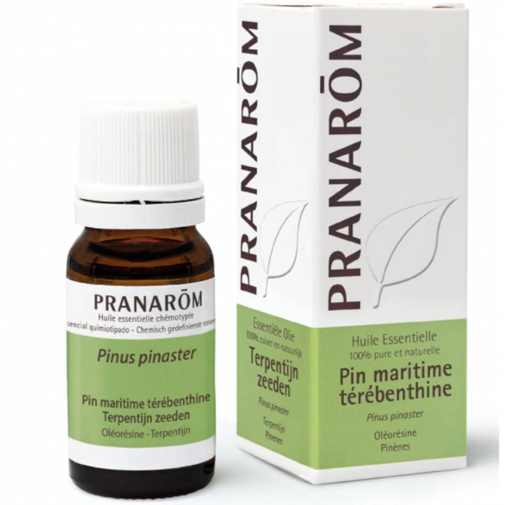 Bruine glazen fles met witte dop en etiket. Witte doos met groen etiket. Opschrift: PRANAROM.