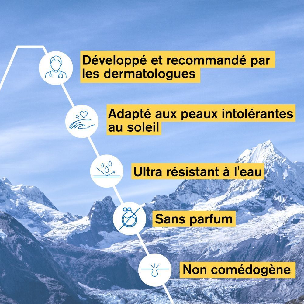 Graphique. Texte: Développé et recommandé par les dermatologues, Adapté aux peaux intolérantes au soleil.