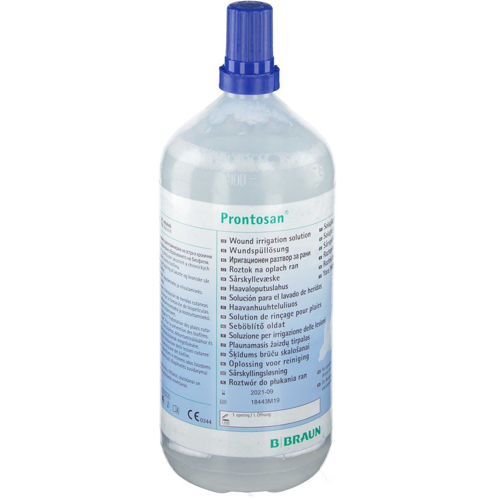Flacon avec bouchon bleu. Inscription : Prontosan. Étiquette du produit avec informations. Marque B. Braun.