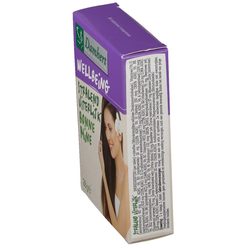 Boîte Damhert Bonne Mine, en biais. Couvercle violet, texte vert. Contient des comprimés. Inscription : Wellbeing, Stralend, Viterlijk, Bonne Mine. Femme avec fleur.