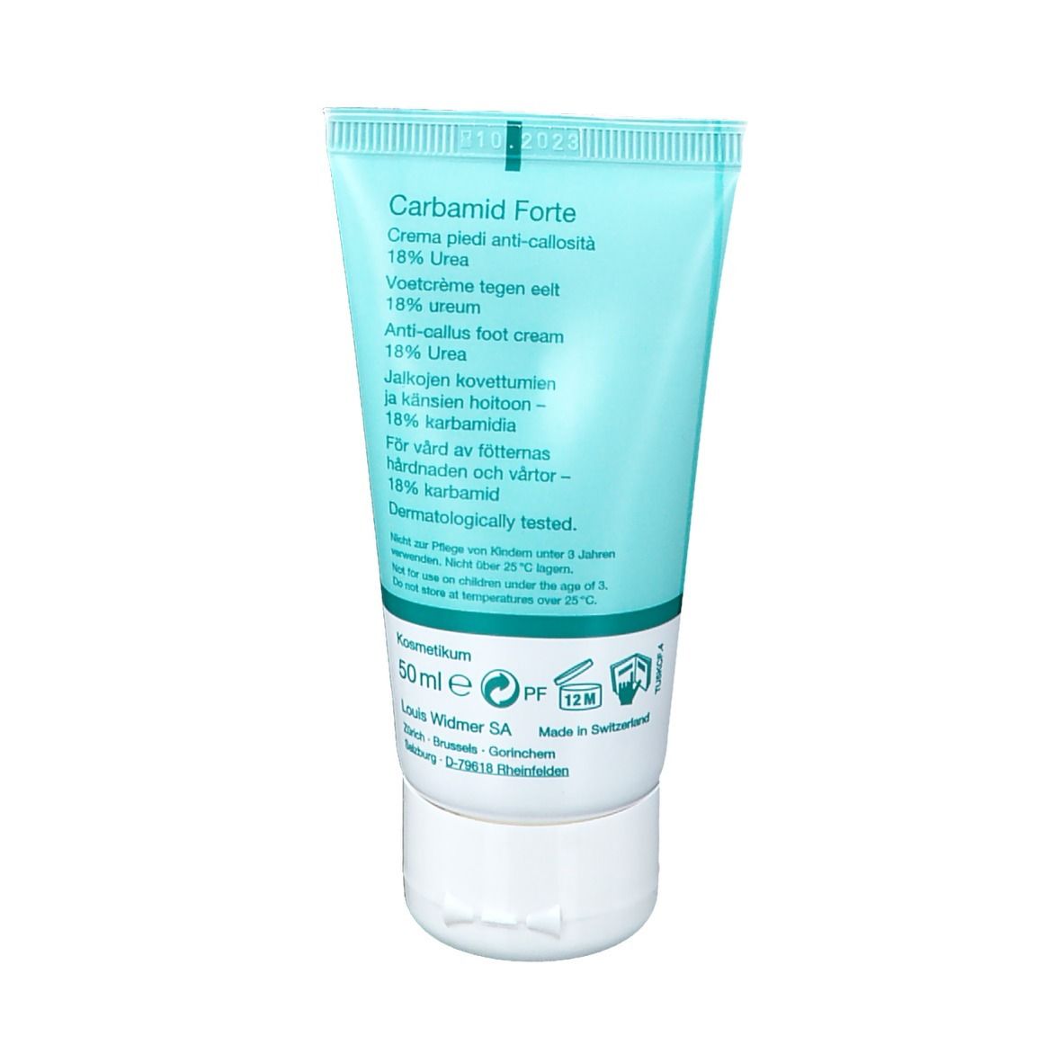 Dos du tube bleu clair. Texte multilingue. Inscription: Carbamide Forte 18% Urea. 50 ml. Testé dermatologiquement.