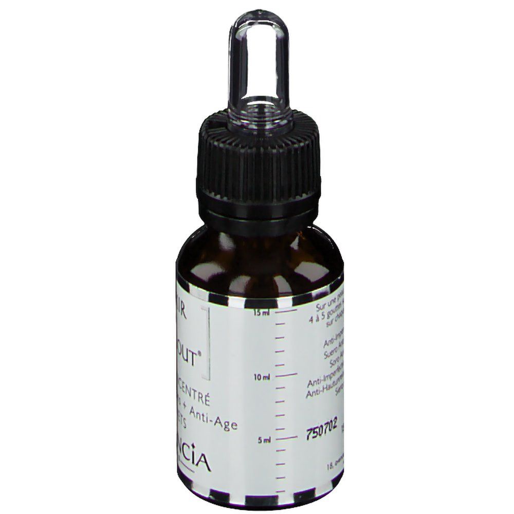 Bruine glazen fles met zwarte dop en pipet. Opschrift: L'Elixir du Marabout. Schaalverdeling. Merk: Garancia.