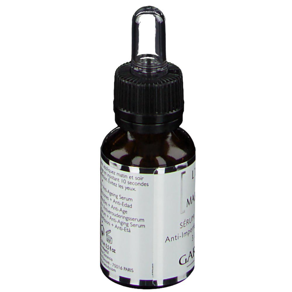 Bruine glazen fles met zwarte dop en pipet. Opschrift: L'Elixir du Marabout, Sérum Concentré, Anti-Imperfections + Anti-Âge. Merk: Garancia.