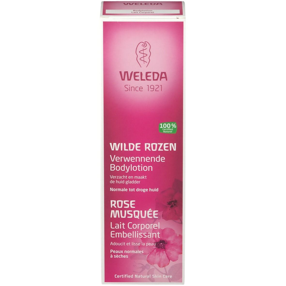 Boîte de lotion corporelle Weleda. Boîte rose avec texte: Wilde Rozen, Rose Musquée. 100% Natural.