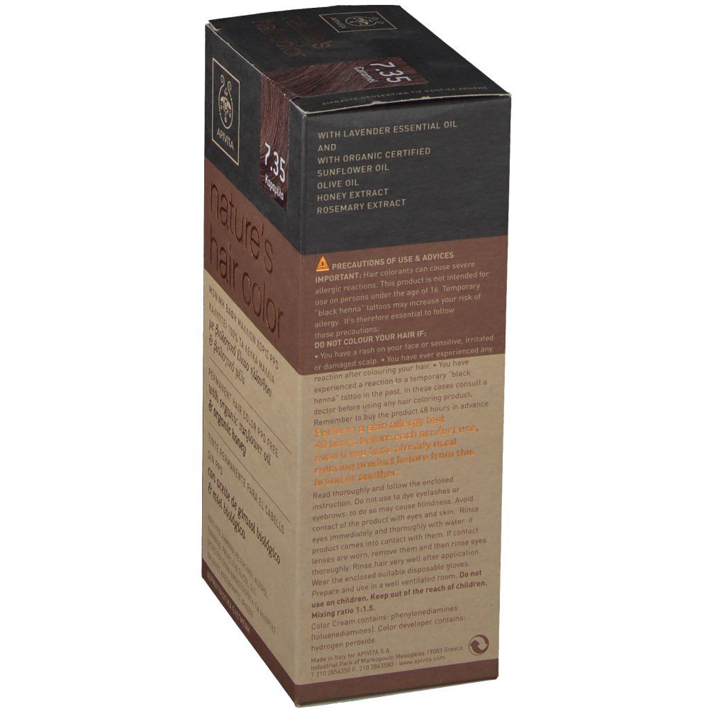 Zijkant haarkleurdoosje. Opschrift: Apivita, nature's hair color. Bevat lavendelolie, zonnebloemolie, olijfolie, honingextract, rozemarijn.