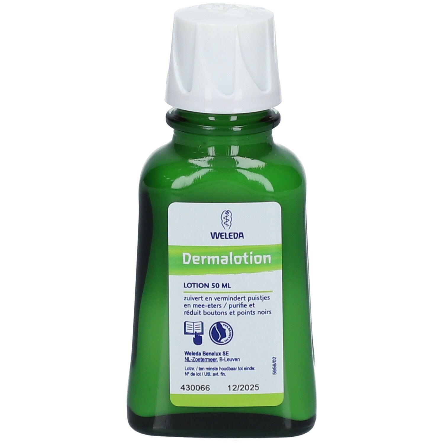 Flacon en verre vert avec bouchon blanc. Étiquette avec nom et texte du produit. Marque Weleda.